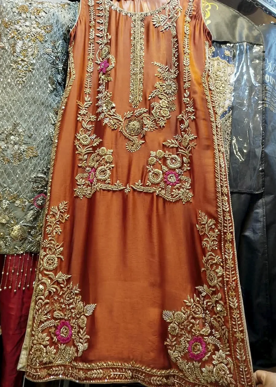 Rust party wear dress with golden floral embroidery