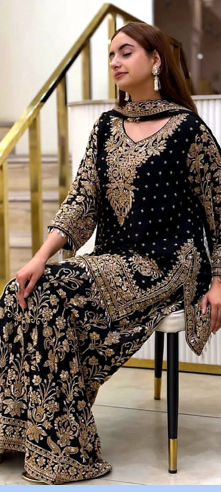 Black and gold heavy formal dress side seated angle